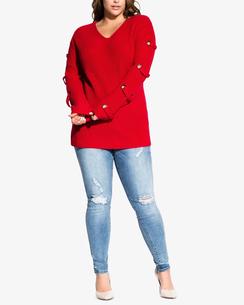 Front of a model wearing a size Petite S City Chic Women's Trendy Plus Size Grommet-Sleeved Sweater Red Size Petite Small in Red by City Chic. | dia_product_style_image_id:314320